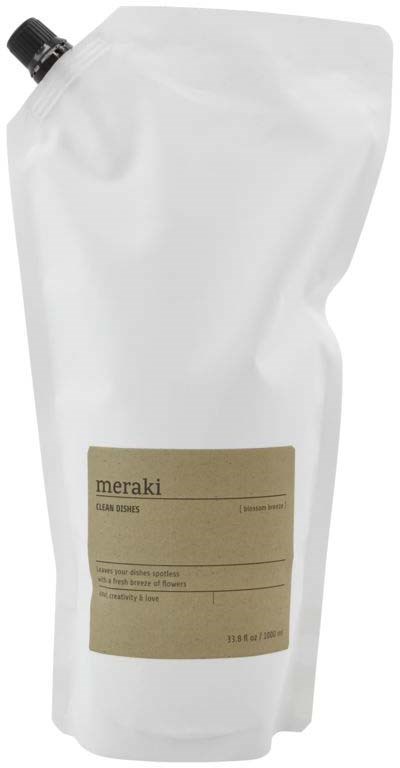 Eine Nachfüllpackung mit schwarzem Deckel, mit "meraki" beschriftet und enthält Flüssigseife oder Lotion.