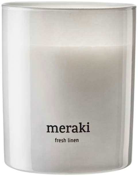 A white candle with a label that says "meraki" and "fresh linen" on it.