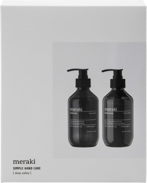 Twee zwarte zeepdispensers gemerkt Meraki op een witte doos.
