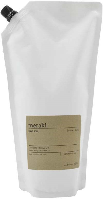 A white refill pouch of Meraki hand soap with a beige label and black cap.
