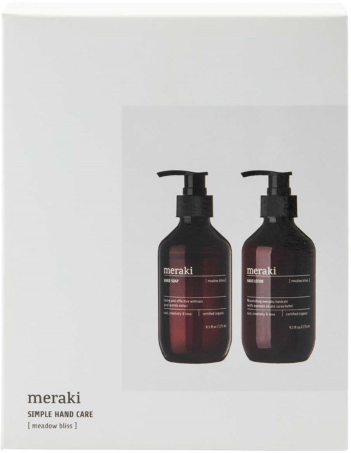 Kaksi tummansinistä pulloa mustilla pumppupäillä, Meraki käsihygienia.
