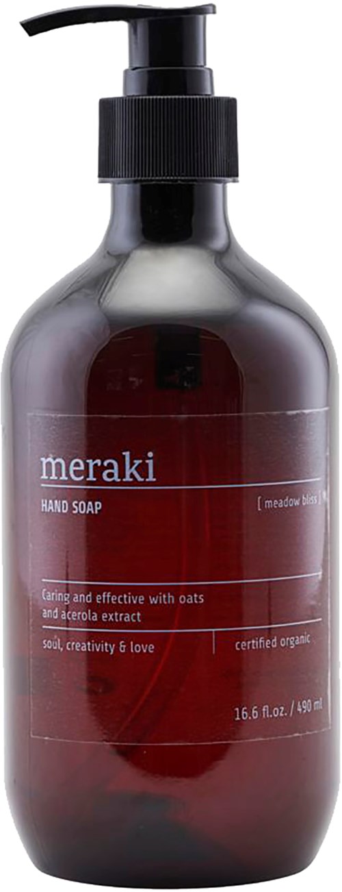 En mørkerød flaske med svart pumpe, merket Meraki håndsåpe, inneholder 16,9 oz, med havre og aloe ingredienser.