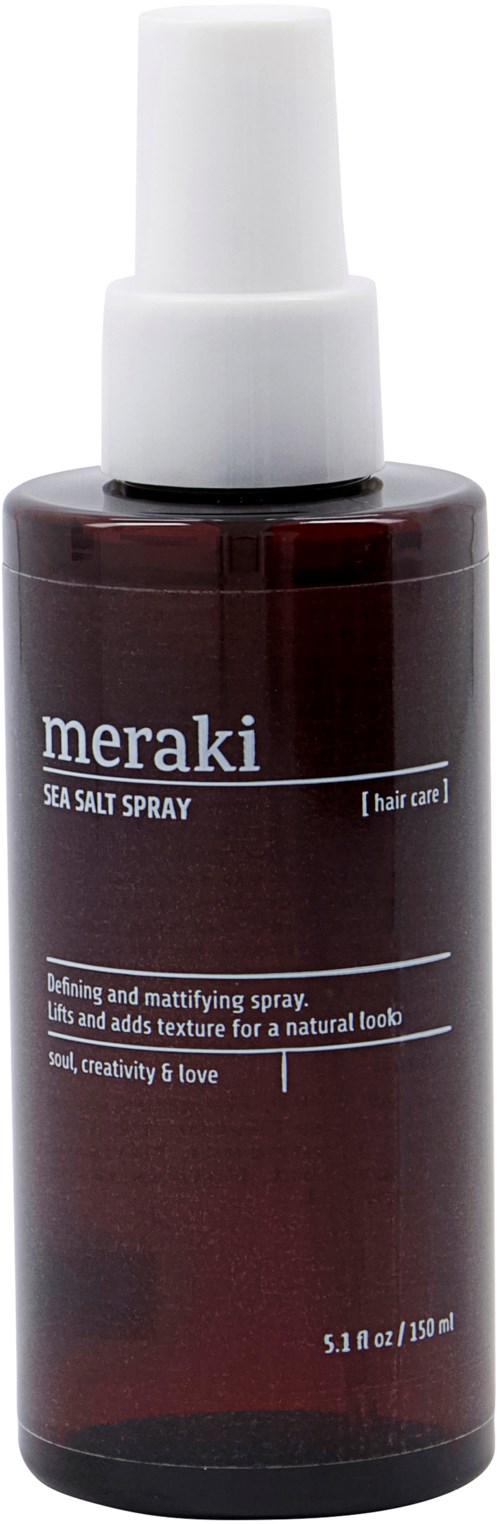 A dark brown bottle with a white spray top, labeled 'Meraki Sea Salt Spray' for hair, containing 5.1 fl oz.