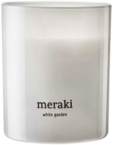 A white candle with black text that says 'meraki' and 'white garden'.