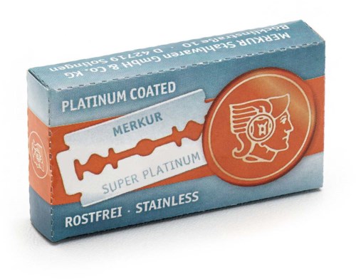 A box of razor blades labeled as platinum coated, stainless, and mercury-free, with a stylized illustration of a woman's head.