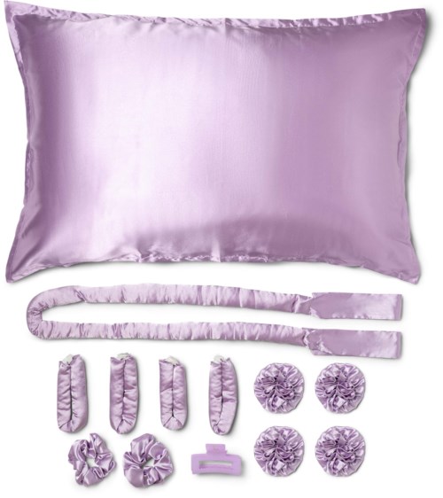 A set of light purple bedding items including a pillow, a long belt, three small cushion covers, four flower-shaped cushions, and a rectangular piece.