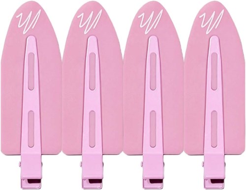Four pink hair clips with a white 'W' design on top.