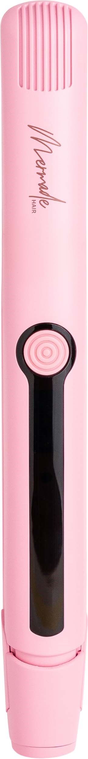 A pink electric toothbrush with a black handle, button, and brand name written in script.