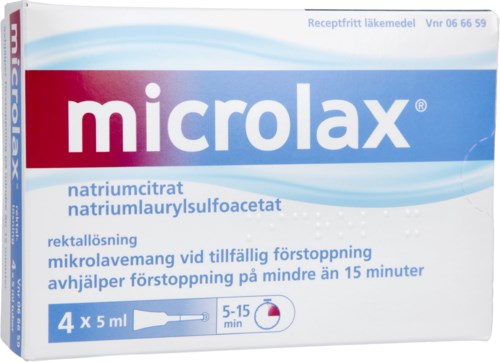En askkopp av Microlax med fyra små tuber för att lindra förstoppning, med instruktioner.