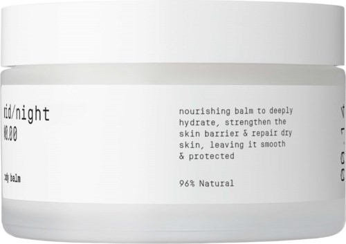 A white jar with black text describing nourishing balm that hydrates and repairs dry skin, making it smooth and protected.