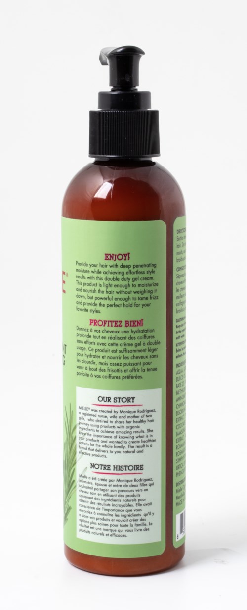 Green and brown bottle with a pump contains a product, with text and labels on the back.