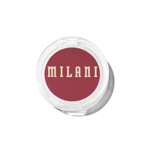Milani logo with the brand name in beige letters on a red background, inside a clear round container.