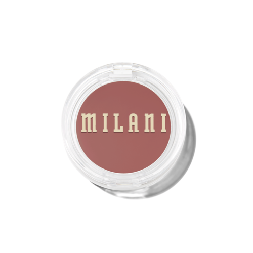 A round makeup blush container with the word 'MILANI' on the lid in beige letters.