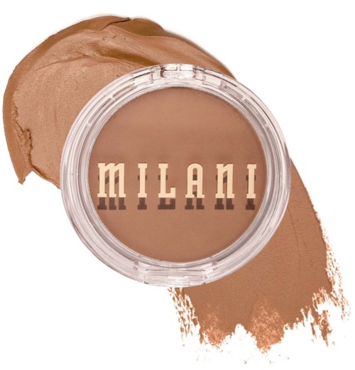 A round container of brown makeup or cream with the word 'Milani' on top, next to a brown smear.