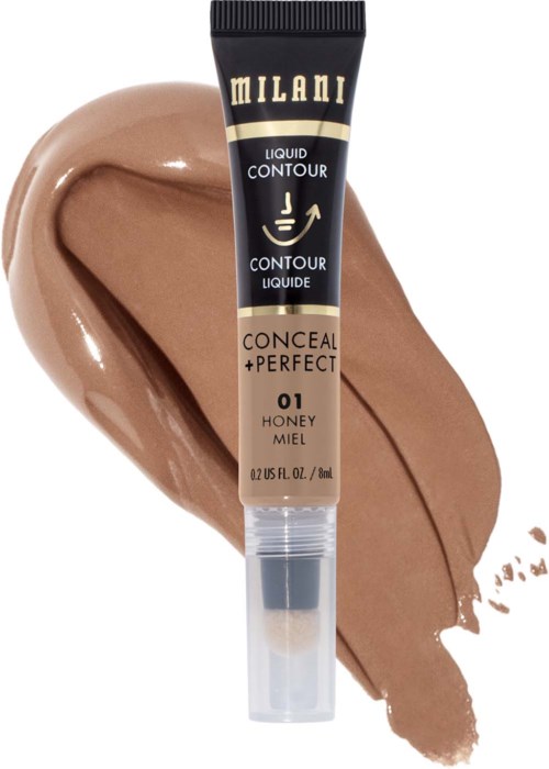 Milani flüssiger Concealer in Honigfarbe mit Make-up im Hintergrund.