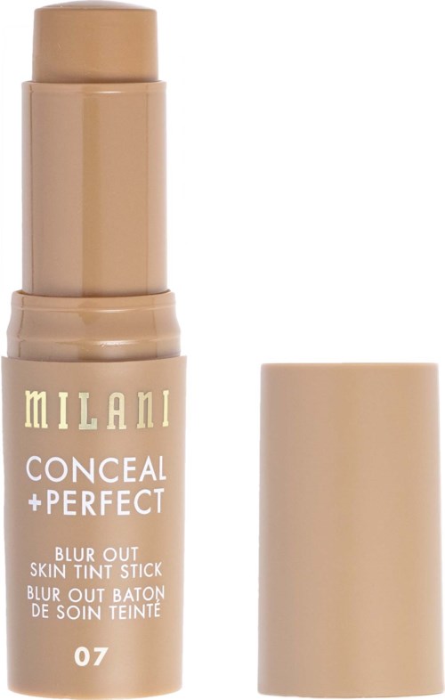 Ett beigefärgat hudfärgat stiftmärkt Milani Conceal + Perfect Blur Out Skin Tint Stick, nyans 07, med lock avlägsnat.