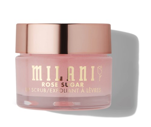 Een kleine roze pot met de tekst 'Milani Rose Sugar Lip Scrub' en een glanzende roségouden deksel, die een schaduw werpt.