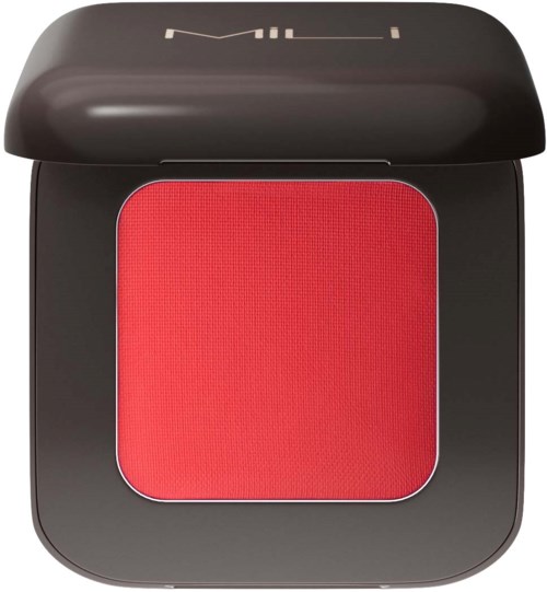 A black compact makeup case with a red powder inside and a mirror on the lid.