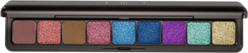 A makeup palette with seven colorful eyeshadows in a black case.