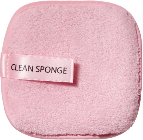 Pigmentert myk svamp med etikett som sier 'CLEAN SPONGE'.