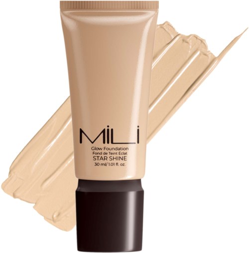 Een tube foundation met een beige dop, gelabeld 'Mi' en 'Glow Foundation, Star Shine.' Verspreid op een textuurachtige beige achtergrond.