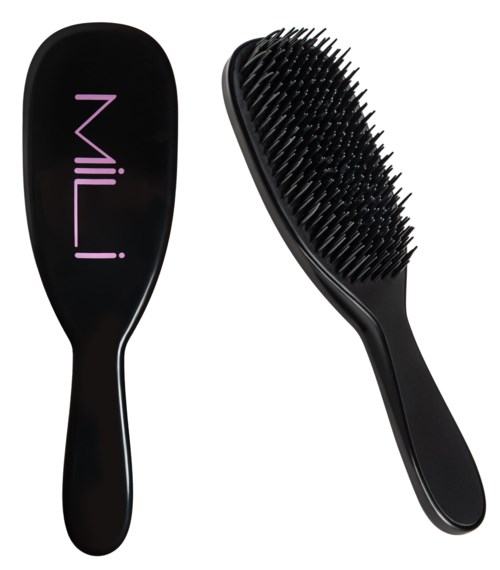 Black hairbrush with a handle and silicone bristles, and a paddle with purple text reading 'Mil' on a black background.