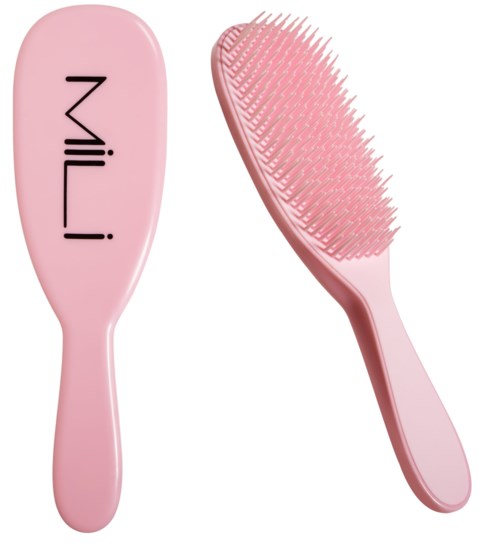 A pink hairbrush with the brand name 'Milani' and soft bristles for grooming hair.