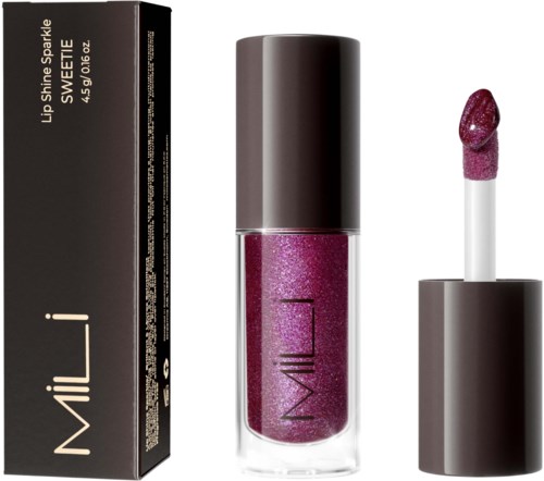 A lip gloss tube with pink shimmering product and a matching lipstick swatch. The product is called 'Lush Shine Sparkle' by MILANI.