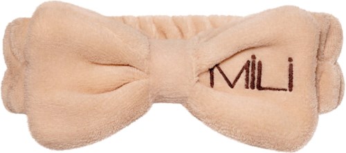 Zacht roze hoofdband met een strik en het woord "Mili" geborduurd.