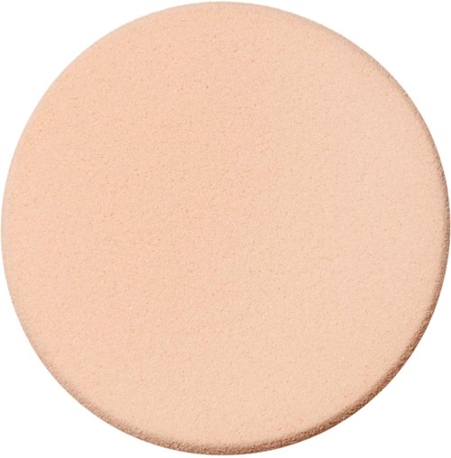 A large, round beige object with a smooth, matte surface and a slight curved edge.