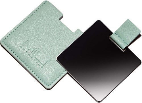 A mint green beauty mirror with a cover, open to show the mirror, and a logo on the cover.