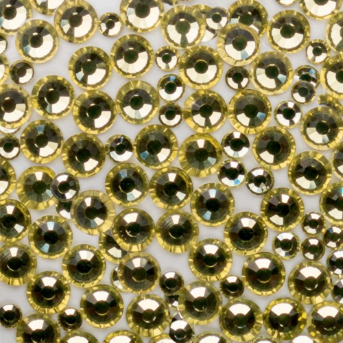 A large collection of small, shiny gold and black gemstones arranged in a pattern.