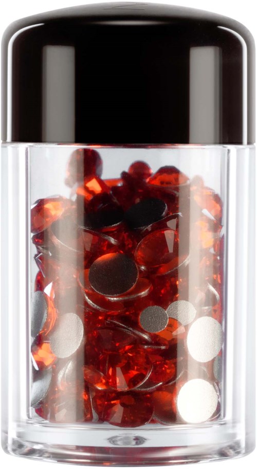A transparent container with a black lid filled with small red and black round objects.