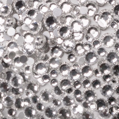 Many small shiny silver rhinestones are closely packed together, creating a sparkling, textured surface.