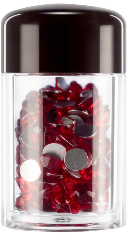 A small transparent container with a black lid filled with red and silver decorative pieces.