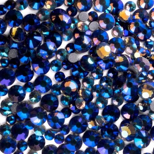 A large collection of shiny, blue, and iridescent rhinestones packed together closely.
