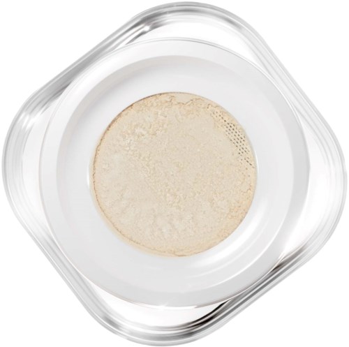 A clear container holds a small amount of beige powder or substance. The container is square with rounded corners.