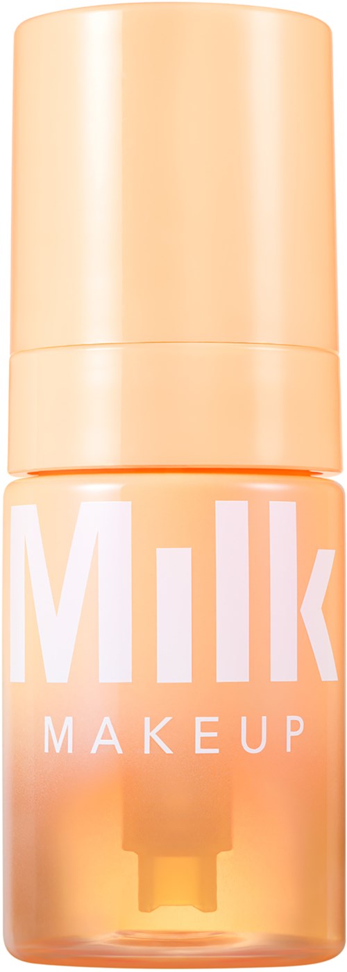 En liten, persikofärgad flaska märkt "MILK MAKEUP" med pump.