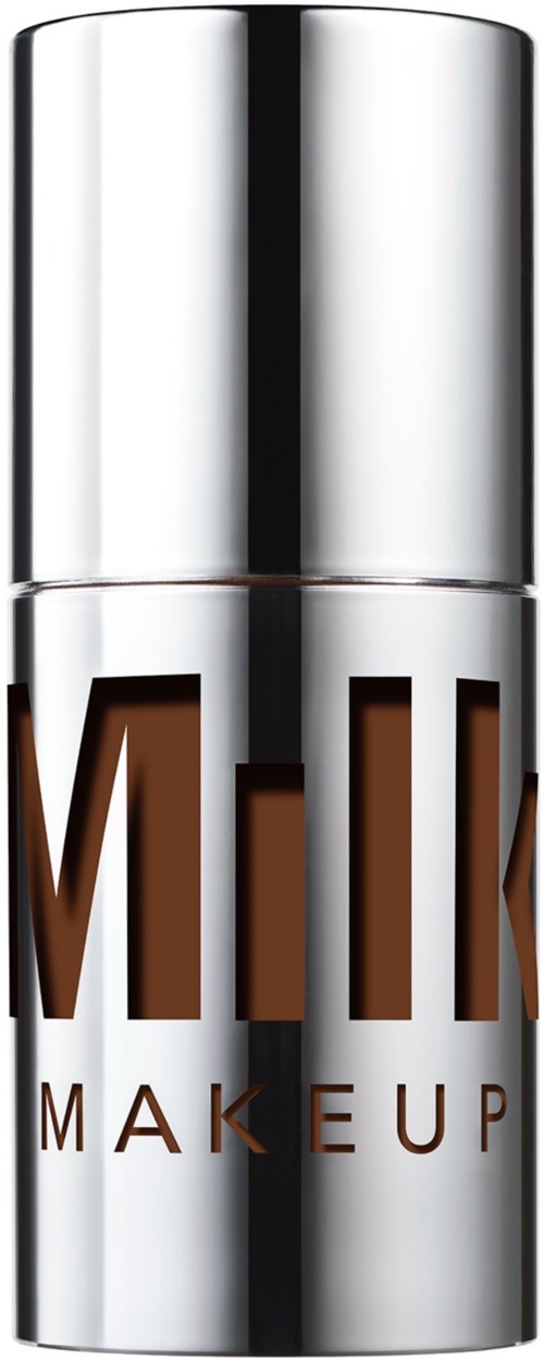 A metallic container with the words 'MILK MAKEUP' on it, likely a cosmetic or skincare product.