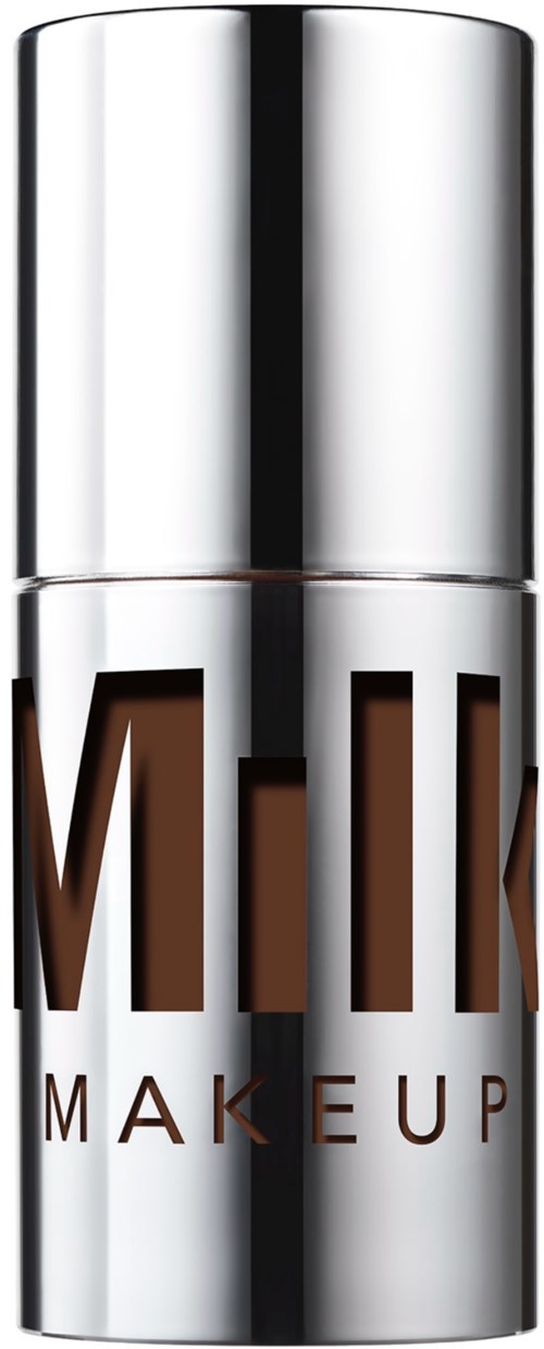 Hopea sävyinen rengasputkilö, jossa lukee 'MILK' ja 'MAKEUP', luultavasti kosmetiikkatuote.
