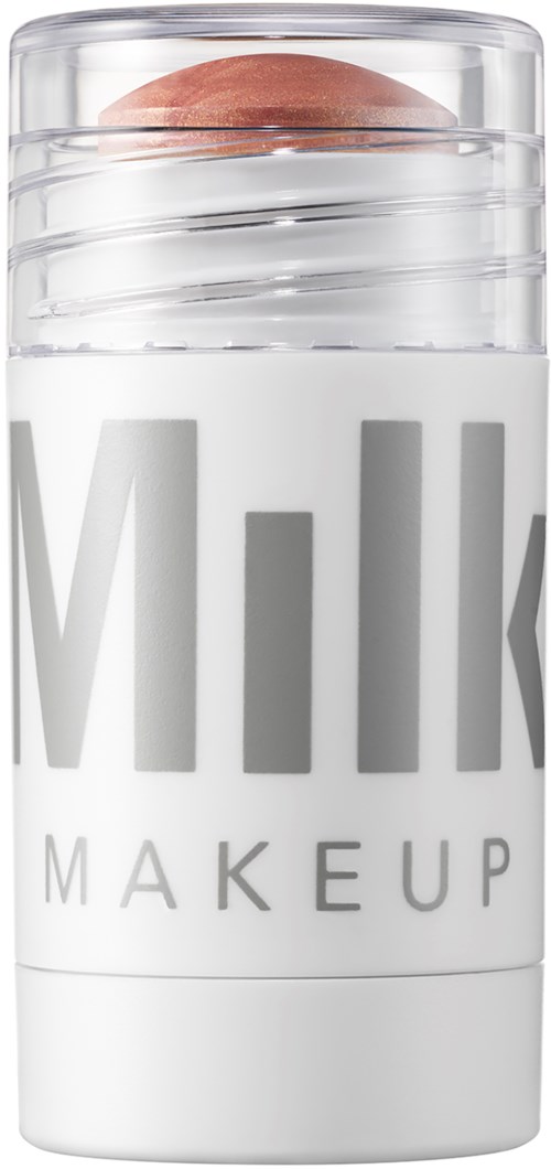 Valkoinen säilytin, jossa on läpinäkyvä kansi ja kirjoitus "Milk Makeup". Säiliö näyttää pyöreältä päältä.
