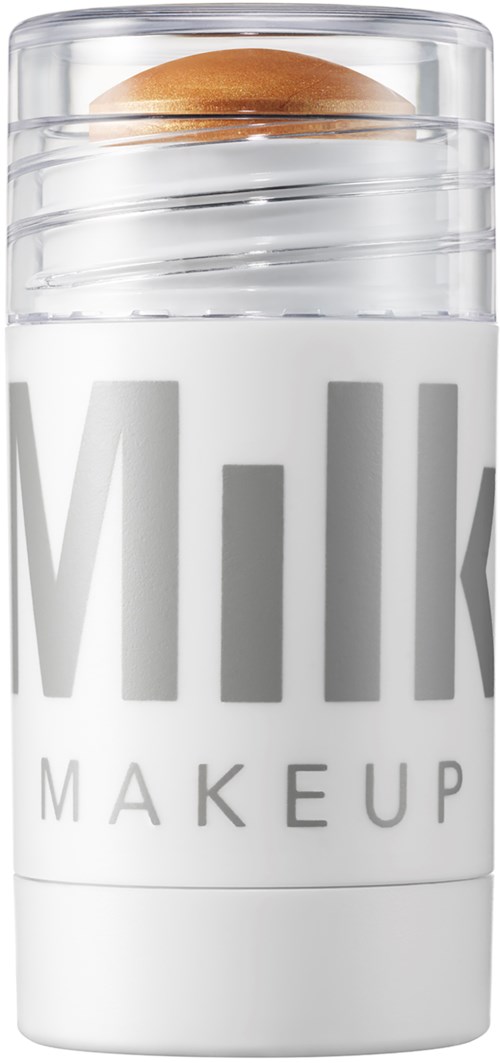 Valkoinen säilytin, jossa on läpinäkyvä kansi, sisältää ruskean meikkisienen, merkinnällä 'Milk Makeup'.
