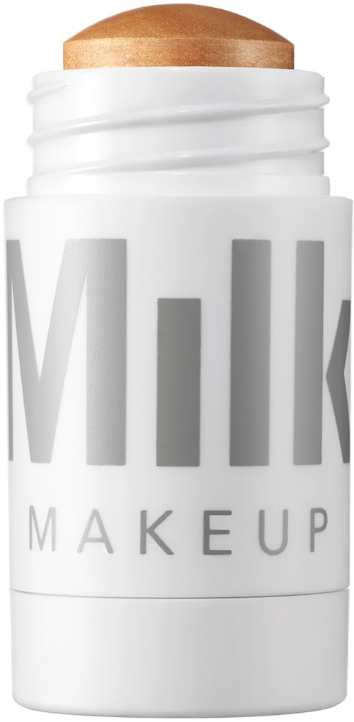 Valkoinen kynä jossa lukee 'Milk' ja 'Makeup', ja päällä on ruskea meikkipuna.