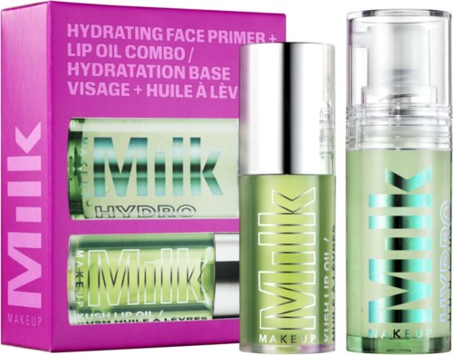 Lichtroze doos met groene flessen voor gezichtsprimer en lipolie, gelabeld 'Milk' door MAKE UP.