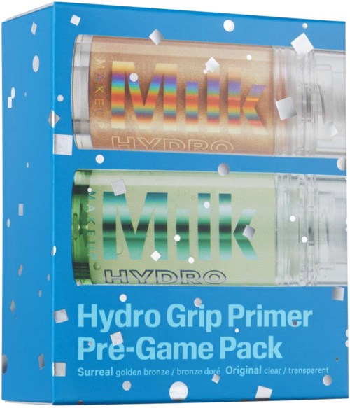 A blue box contains two tubes labeled "Milk" with colored caps, and the box is decorated with white confetti.