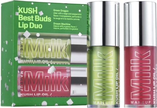 Een lipset met groene en roze lipoliën in kleine flessen en een groene doos met productdetails.