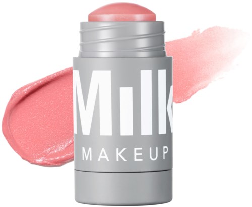Ein rosa Creme-Stick mit einem grauen und weißen Behälter mit den Worten 'Milk Makeup'.