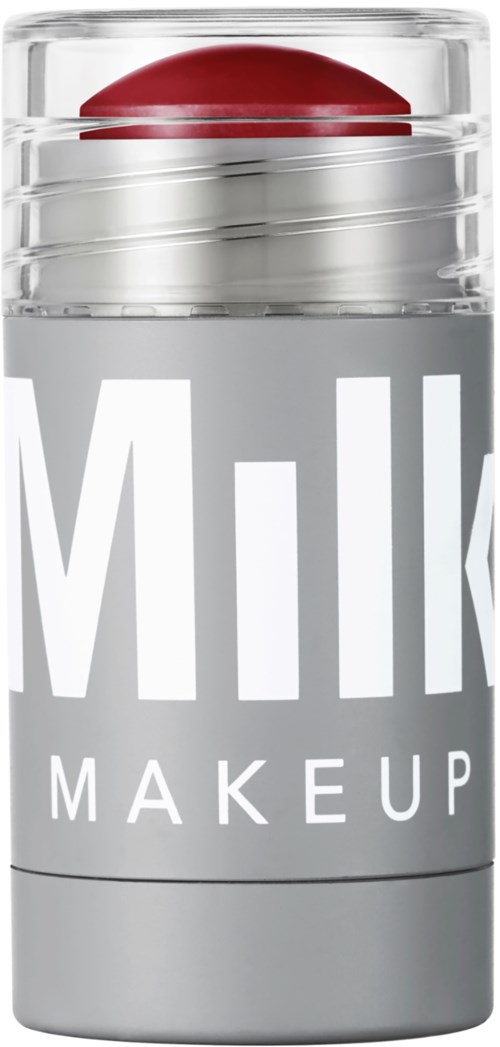 Een zilveren container met een rood deksel, gelabeld "Milk Makeup".