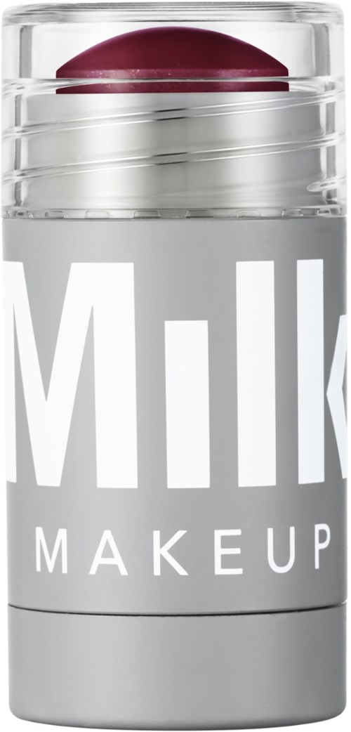 Eine klare Make-up-Behälter mit rotem Lippenstift darin, beschriftet 'Milk Makeup' in großen weißen Buchstaben.