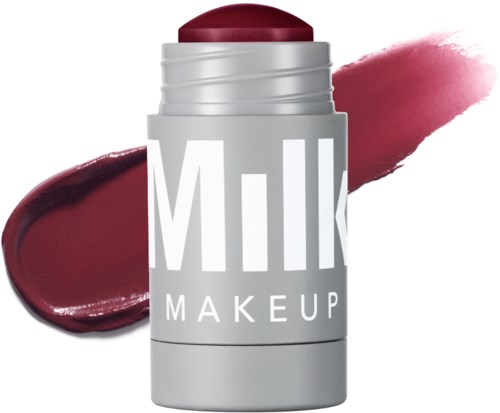 Lippenbalsam mit rotem Lippenstiftfarbton, gekennzeichnet 'Milk Makeup'. Mustern des Produkts vor weißem Hintergrund.